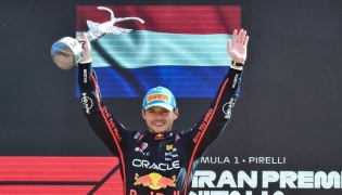 Red Bull Racing's Dutch driver Max Verstappen celebrates his victory on the podium after winning the Italian Formula One Grand Prix at the Autodromo Nazionale Monza circuit, in Monza, northern Italy, on September 7, 2025. (Photo by Marco Bertorello / AFP)
