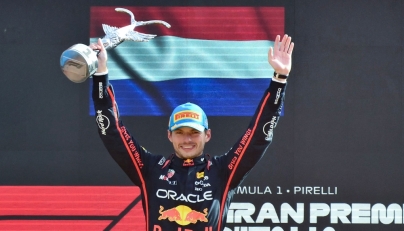 Red Bull Racing's Dutch driver Max Verstappen celebrates his victory on the podium after winning the Italian Formula One Grand Prix at the Autodromo Nazionale Monza circuit, in Monza, northern Italy, on September 7, 2025. (Photo by Marco Bertorello / AFP)