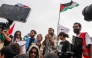 Brazilian activist Thiago Avila speaks to the crowd of pro-Palestinian activists that arrived to greet the Global Sumud Flottila at the port of the village of Sidi Bou Said on September 7, 2025. (Photo by Yassine Mahjoub / AFP)