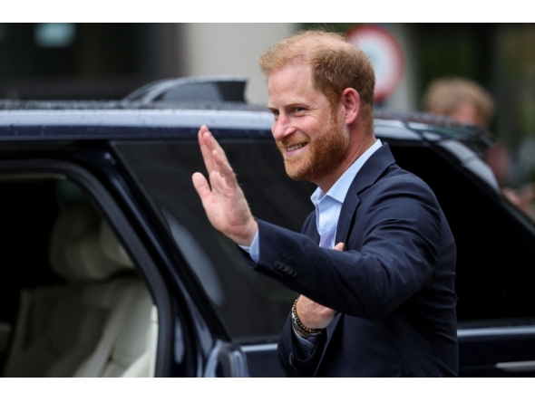 Britain's Prince Harry, Duke of Sussex waves as he departs the Centre for Blast Injury Studies, at the Imperial College in London, on September 10, 2025. (Photo by Suzanne Plunkett / POOL / AFP)
