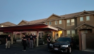 Forensic agents are seen at the apartment complex where Tyler Robinson lives in St. George, Utah, on September 12, 2025. (Photo by Romain Fonsegrives / AFP)
 