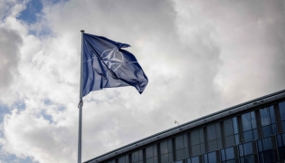 File photo- A NATO flag flies at the NATO headquarters in Brussels on September 12, 2025. (Photo by Simon Wohlfahrt/ AFP) 