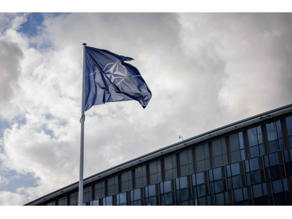 File photo- A NATO flag flies at the NATO headquarters in Brussels on September 12, 2025. (Photo by Simon Wohlfahrt/ AFP) 