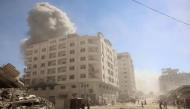 Smoke billows after an Israeli strike on a building in Gaza City's Tal al-Hawa district on September 13, 2025. (Photo by Omar AL-QATTAA / AFP)
