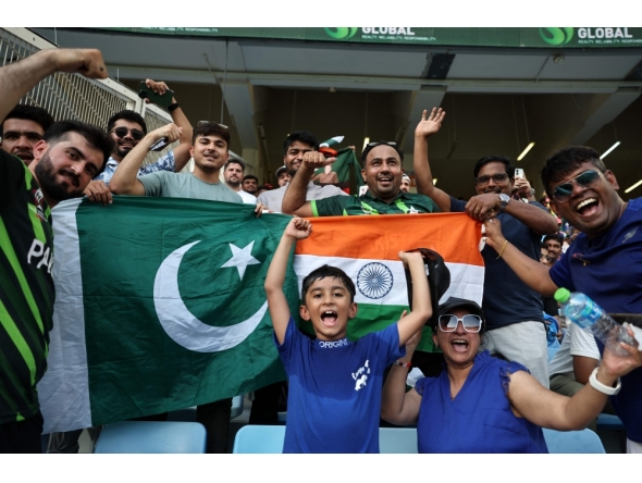 Pakistan and India fans cheer before the start of the Asia Cup 2025 Twenty20 international cricket match between India and Pakistan at the Dubai International Stadium in Dubai on September 14, 2025. (Photo by Fadel Senna / AFP)