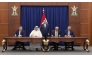 Prime Minister of Iraq H E Mohammed Shia Al-Sudani looks on as Minister of State for Energy Affairs, President and CEO of QatarEnergy, H E Saad Sherida Al-Kaabi; Chairman and CEO of TotalEnergies, Patrick Pouyanné; and other officials sign documents at a ceremony held in Baghdad yesterday.