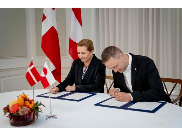 Denmark's Prime Minister Mette Frederiksen (L) and Greenland's government leader Jens Frederik Nielsen sign a framework agreement for a self-sustaining Greenland at the Prime Minister's Office in Copenhagen, Denmark, on September 16, 2025. (Photo by Mads Claus Rasmussen / Ritzau Scanpix / AFP) 