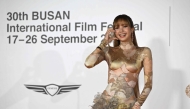 Lisa, a member of the K-pop group Blackpink, arrives on the red carpet during the opening ceremony of the 30th Busan International Film Festival (BIFF) at the Busan Cinema Center in Busan on September 17, 2025. (Photo by Jung Yeon-je / AFP)