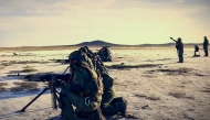 This handout picture released on September 18, 2025, by the CEOFANB (Strategic Operations Command of the Bolivarian National Armed Forces of Venezuela) shows Venezuelan soldiers during military exercises on the shores of the Caribbean island of La Orchila, Venezuela. (Photo by Handout / CEOFANB / AFP)
