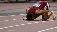 Qatar's athlete Abderrahman Samba reacts after competing in the men's 400m hurdles final during the World Athletics Championships in Tokyo on September 19, 2025. (Photo by Andrej ISAKOVIC / AFP)
