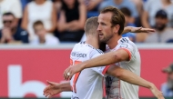Bayern Munich's English forward #09 Harry Kane (R) celebrates with team mate Bayern Munich's Austrian midfielder #27 Konrad Laimer after scoring his team's third goal during the German first division Bundesliga football match between TSG 1899 Hoffenheim and FC Bayern Munich in Sinsheim, southwestern Germany on September 20, 2025. (Photo by Daniel ROLAND / AFP)