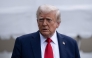 US President Donald Trump stops to speak with reporters while walking to Marine One on the South Lawn of the White House September 21, 2025, in Washington, DC. Trump is heading to Glendale, Arizona to attend the public memorial service for Charlie Kirk. (Photo by Brendan Smialowski / AFP)
