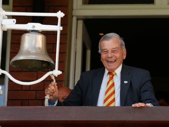 File: Retired umpire Dickie Bird rings the five minute bell during play on the first day of the first cricket Test match between England and New Zealand at Lord's cricket ground in London on May 21, 2015. (Photo by Ian Kington / AFP) 