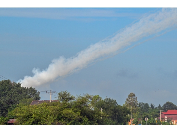 Smoke is pictured in the air from a multi-rocket launcher near the Cambodia-Thailand border in Oddar Meanchey province on July 25, 2025. (Photo by TANG CHHIN Sothy / AFP)