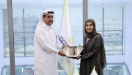 Director of Al Jazeera Media Institute, Eman Al-Amri; and Senior Executive Vice President - Group Human Capital, QNB Group, Abdullah Nasser Al Khalifa, at the agreement signing ceremony. 
