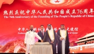 Minister of Commerce and Industry H E Sheikh Faisal bin Thani bin Faisal Al Thani and Ambassador of China to Qatar H E Cao Xiaolin and other officials cutting a cake to mark 76th anniversary of the founding of the People’s Republic of China.