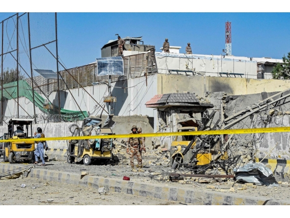 Security personnel inspect an explosion site outside the Frontier Corps (FC) headquarters in Quetta on September 30, 2025. (Photo by Banaras KHAN / AFP)