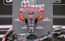 Aprilia Racing team's Italian MotoGP rider Marco Bezzecchi celebrates on the podium after winning the Sprint Race at the MotoGP Indonesian Grand Prix on October 4, 2025. C (Photo by Sonny Tumbelaka / AFP)