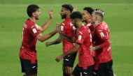 Al Rayyan's Rodrigo Moreno (second right) celebrates with teammates.