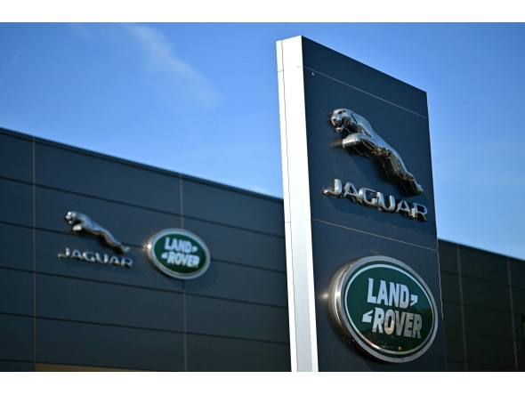 Jaguar Land Rover signage is seen on a dealership in Tonbridge south-east of London on September 29, 2025. Photo by Ben STANSALL / AFP

