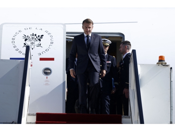 France's President Emmanuel Macron arrives for the Gaza Summit in Sharm El-Sheikh, Egypt on October 13, 2025. (Photo by Yoan Valat / POOL / AFP)