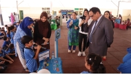  A student explaining his project to officials.
