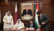 Minister of State for Foreign Trade Affairs, H E Dr. Ahmed bin Mohammed Al-Sayed, and Minister of Economic Development and Trade of the Republic of Tajikistan, H E Zavqi Zavqizoda, during the signing ceremony.