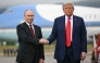 (FILES) US President Donald Trump greets Russian President Vladimir Putin on the tarmac after they arrived at Joint Base Elmendorf-Richardson in Anchorage, Alaska, on August 15, 2025. 