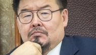 Mongolian Prime Minister Gombojav Zandanshatar looks on as he attends a vote on his dismissal during a plenary session at the parliament in Ulaanbaatar on October 17, 2025. Photo by Byambasuren BYAMBA-OCHIR / AFP