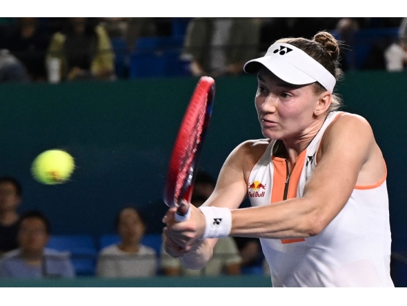 Kazakhstan's Elena Rybakina hits a return to Italy's Jasmine Paolini on October 18, 2025. (Photo by AFP)