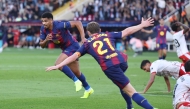 Barcelona's Uruguayan defender Ronald Federico Araujo da Silva celebrates scoring his team's second goal during the Spanish league football match between FC Barcelona and Girona FC at Estadi Olimpic Lluis Companys in Barcelona on October 18, 2025. (Photo by Josep LAGO / AFP)