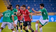 Al Rayyan's Gabriel Pereira is challenged by Al Waab players.