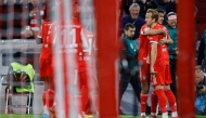 Bayern Munich's English forward #09 Harry Kane celebrates scoring the opening goal with his teammates during the German first division Bundesliga football match FC Bayern Munich vs BVB Borussia Dortmund, in Munich, southern Germany on October 18, 2025. (Photo by Alexandra BEIER / AFP)
