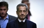 France's former president Nicolas Sarkozy leaves his residence to present himself to La Sante Prison in Paris, on October 21, 2025. Photo by julien de rosa / AFP