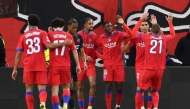 Paris Saint-Germain (PSG) players celebrate win against Bayer 04 Leverkusen at the UEFA Champions League at the BayArena stadium in Leverkusen, western Germany on October 21, 2025. (Photo by Franck Fife / AFP)