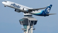 An Alaska Airlines plane takes off near the air traffic control tower at Los Angeles International Airport on October 22, 2025 in Los Angeles, California. Photo by MARIO TAMA / GETTY IMAGES NORTH AMERICA / Getty Images via AFP