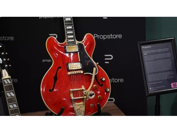 The cherry-red Gibson ES-355 guitar is famous for having been damaged during a fight that led to the Oasis band breaking up in August 2009. (Justin Tallis / AFP)