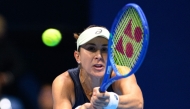 Switzerland's Belinda Bencic hits a return against Czech Republic's Linda Noskova during the women's singles final at the Pan Pacific Open tennis tournament in Tokyo on October 26, 2025. (Photo by Philip Fong / AFP)