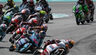 Riders compete in the Moto3 race at the MotoGP Malaysian Grand Prix at the Sepang International Circuit in Sepang on October 26, 2025. (Photo by Lillian SUWANRUMPHA / AFP)
