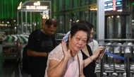 Monica Liu, an Indian citizen and entrepreneur with origins from China, prepares to depart for Guangzhou, from the Netaji Subhas Chandra Bose International Airport in Kolkata on October 26, 2025. (Photo by Dibyangshu Sarkar / AFP)
