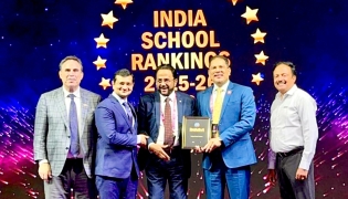Podar Pearl School President, C. Muhamed Nizar; Principal Dr. Maneesh Mangal; and others with the award. 