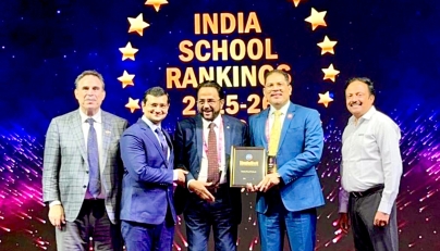 Podar Pearl School President, C. Muhamed Nizar; Principal Dr. Maneesh Mangal; and others with the award.