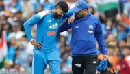 A medical team member helping Iyer off the pitch. Photo/BCCI