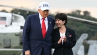 US President Donald Trump and Japan's Prime Minister Sanae Takaichi arrive on board the US Navy's USS George Washington aircraft carrier at the US naval base in Yokosuka on October 28, 2025. (Photo by Andrew Caballero-Reynolds / AFP)

