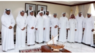 Minister of Municipality H E Abdullah bin Hamad bin Abdullah Al Attiyah (fourth right) with fishermen during the meeting