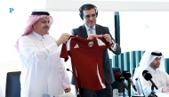 Executive Director of Earthna, Dr. Gonzalo Castro de la Mata, and QRCS Assistant Secretary-General for Communication and Resource Development, Mohamed Al Beshri, display the first jersey donated by the Qatar National Football Team to the “1 Million Jerseys for Gaza” campaign.  Pic: Rajan Vadakkemuriyil/The Peninsula.