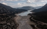 This aerial photograph shows the low water level of the Mornos artificial lake following a drought, near the village of Lidoriki, about 240 km northwest of Athens, on September 1, 2024. Photo by Angelos TZORTZINIS / AFP