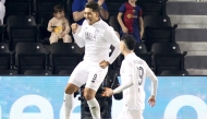 Al Sadd's Roberto Firmino (left) celebrates with teammate Rafa Mujica after scoring a goal against Al Rayyan yesterday. 