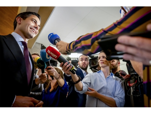 Leader of D66 (Democrats 66) Rob Jetten (L) speaks to journalists in The Hague on Ocotber 31, 2025, after the D66 party won the the Dutch parliamentary elections. (Photo by Robin Utrecht / ANP / AFP)