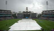 Raincovers are spread over the pitch before the start of the ICC Women's Cricket World Cup 2025 one-day international (ODI) final match in Navi Mumbai on November 2, 2025. (Photo by Punit Paranjpe / AFP) 